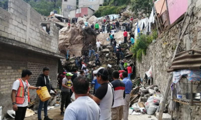 Con palas y botes, vecinos se organizan para retirar escombros del cerro